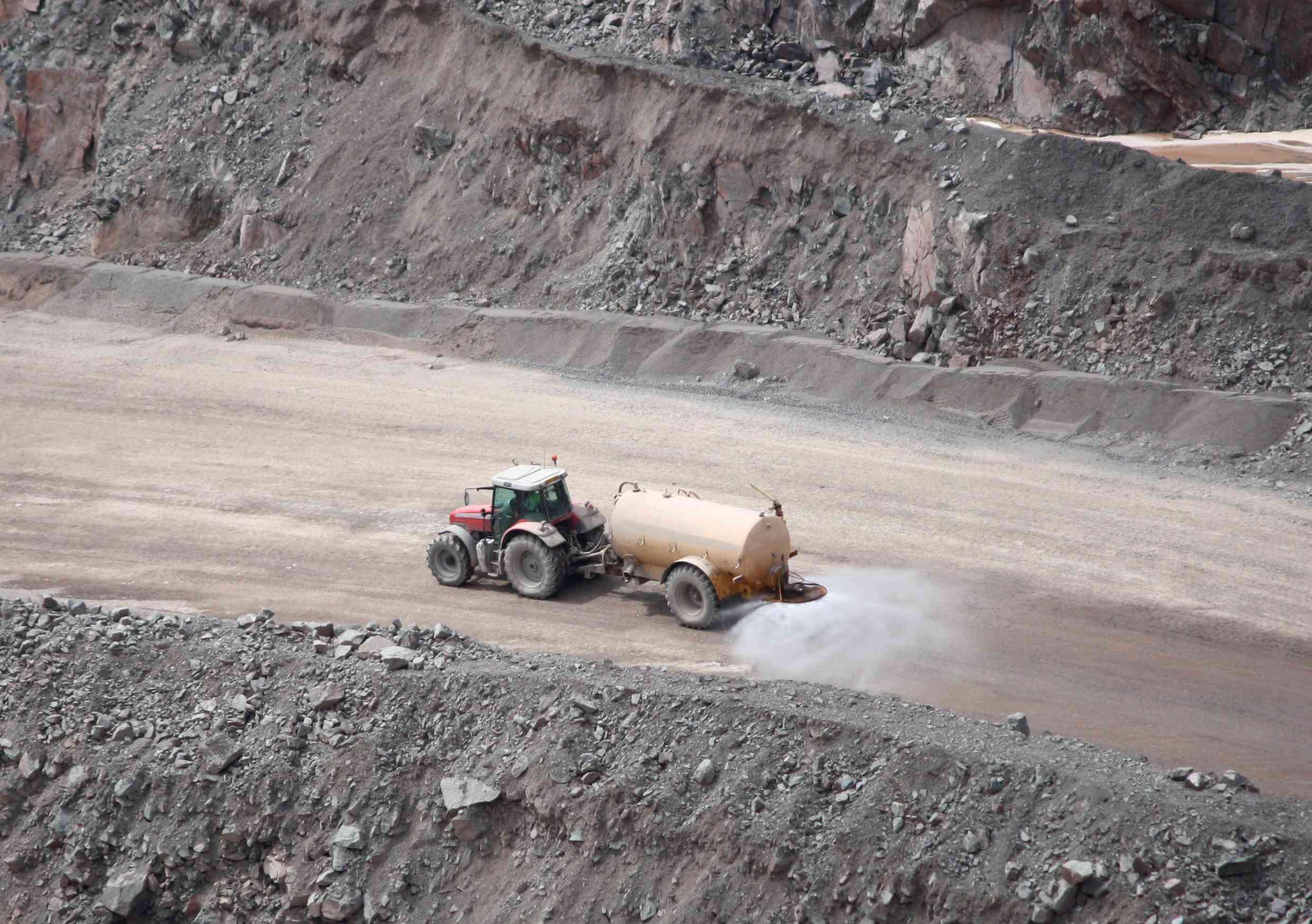 Detail of A Quarry Tractor Towing a Dust Suppression Sprayer