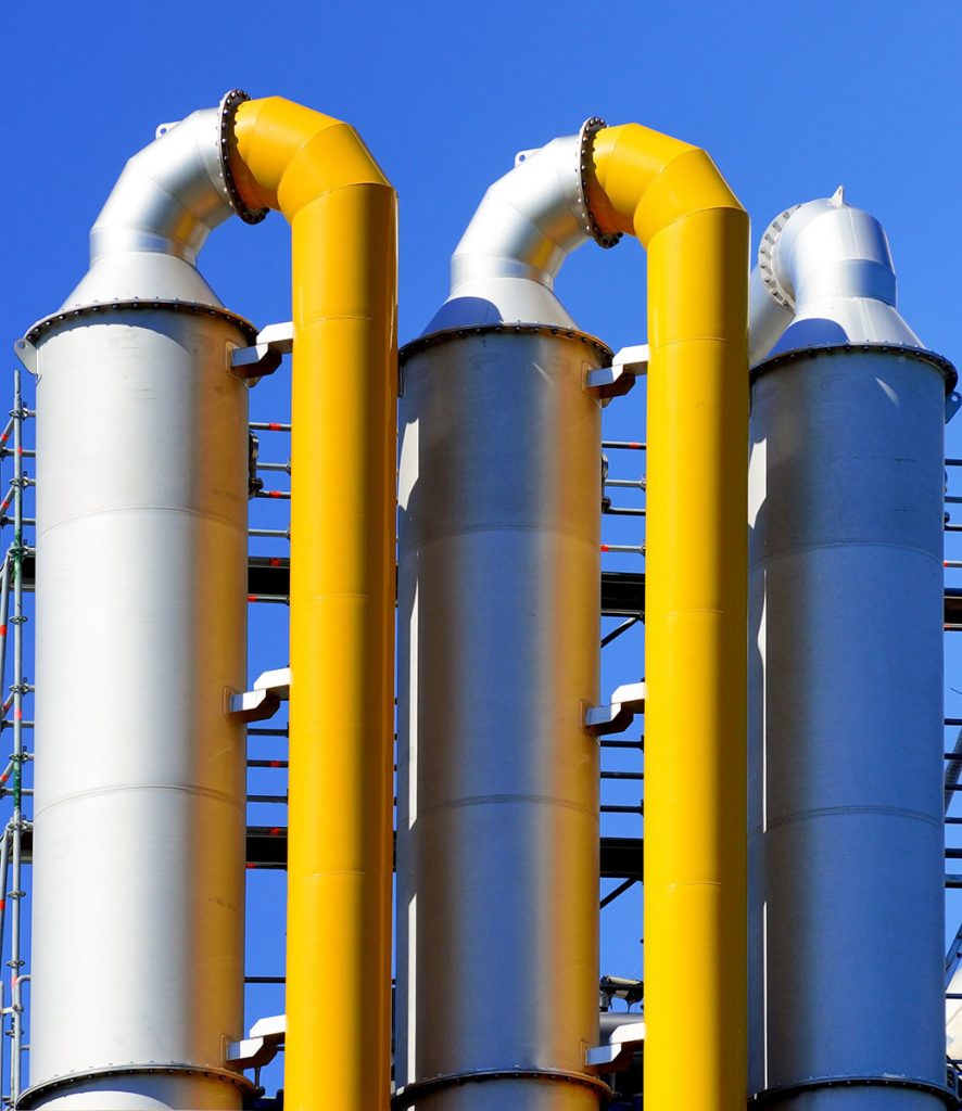 Industrial gas scrubbing equipment adjacent to the smokestack
