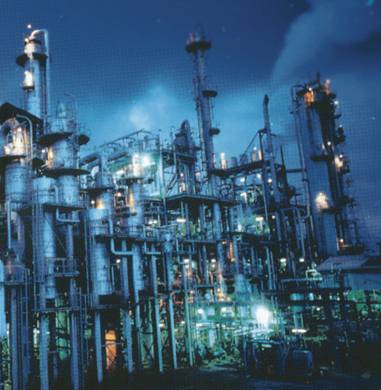 Image of chemical refinery plant shown with lights at night